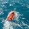 Marine crews of a pipelay barge performing man overboard emergency rescue drill at Kemaman Port Anchorage