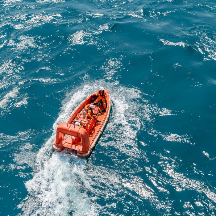 Marine crews of a pipelay barge performing man overboard emergency rescue drill at Kemaman Port Anchorage