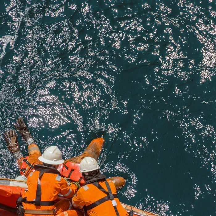 Marine crews of a pipelay barge performing man overboard emergen