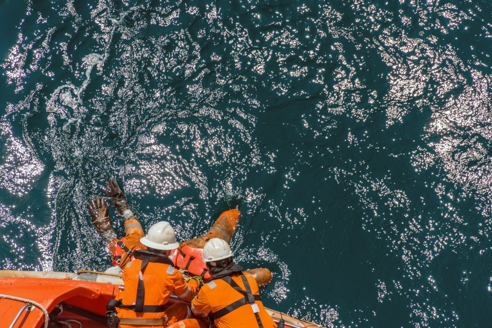 Marine crews of a pipelay barge performing man overboard emergen