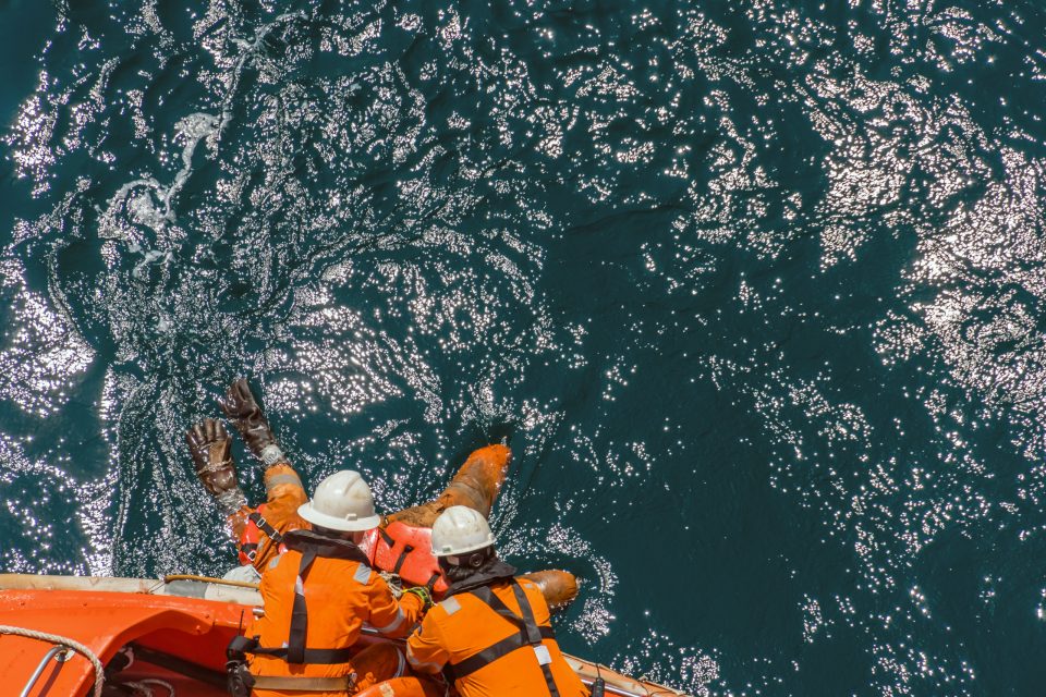Marine crews of a pipelay barge performing man overboard emergen